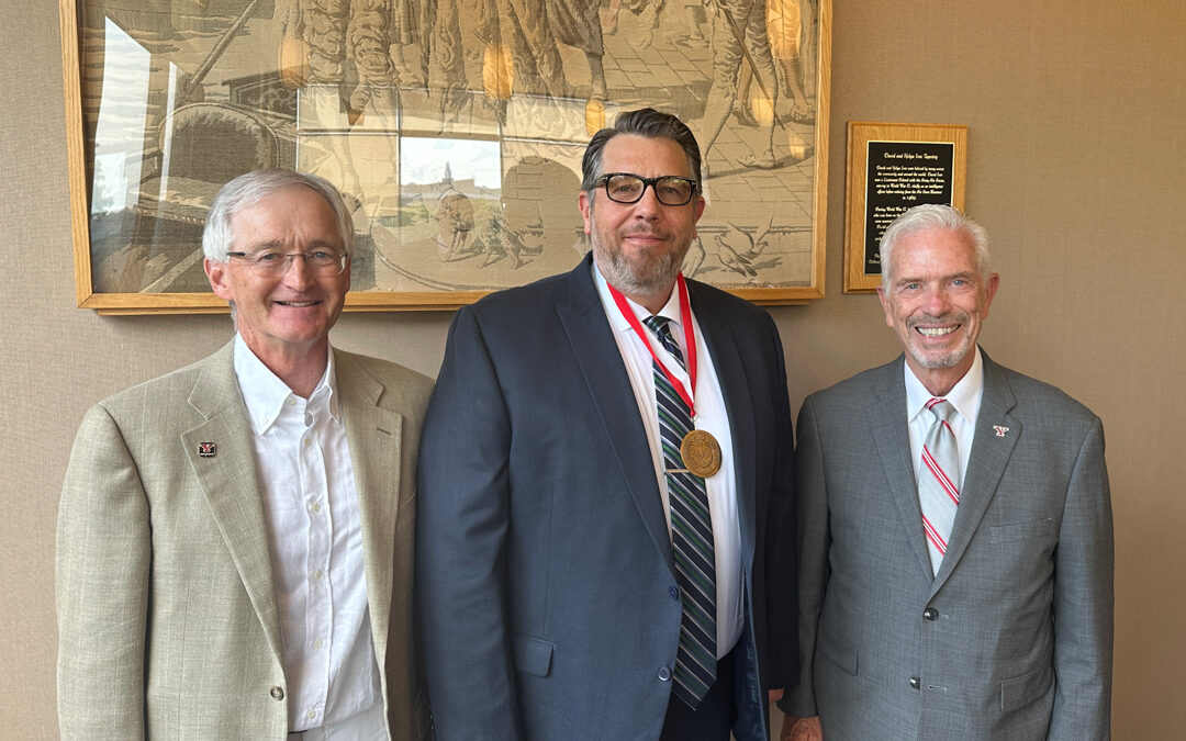 Photo of Robert Reeder the third, Dr. Corey Andrews, and YSU President Bill Johnson.